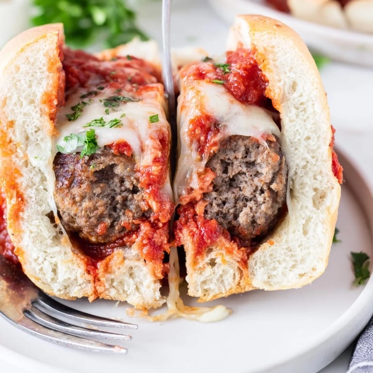 The Meatball Sub features four meatballs stuffed into a toasted hoagie roll with provolone.